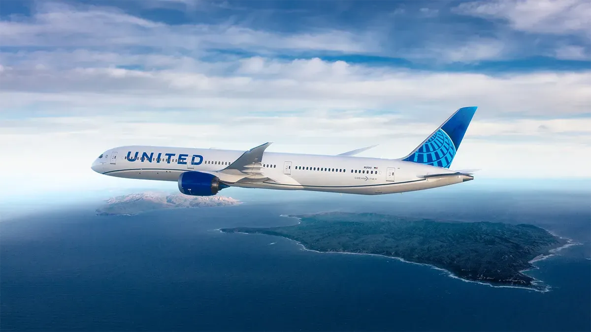 A photograph of a United Airlines plane in flight