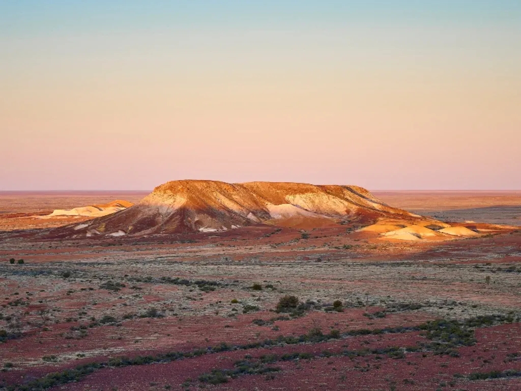 A mound among the arid landscape of Coober Pedy in Australia