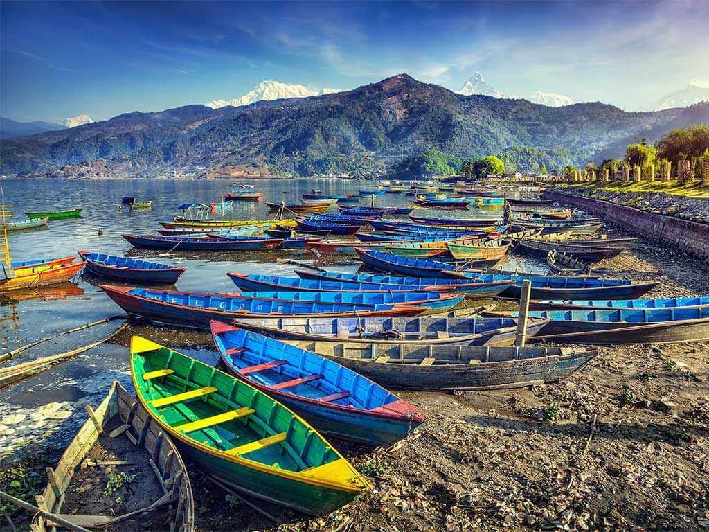 Colorful boats along the shore in Nepal