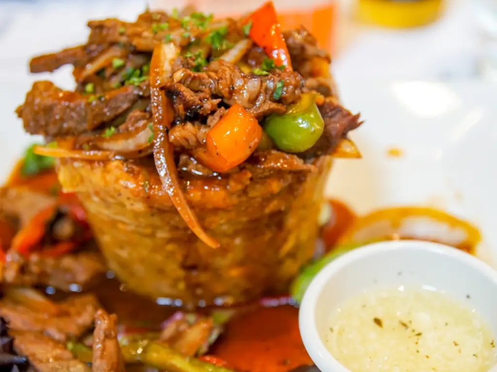 Dish of monfongo with meat on top 