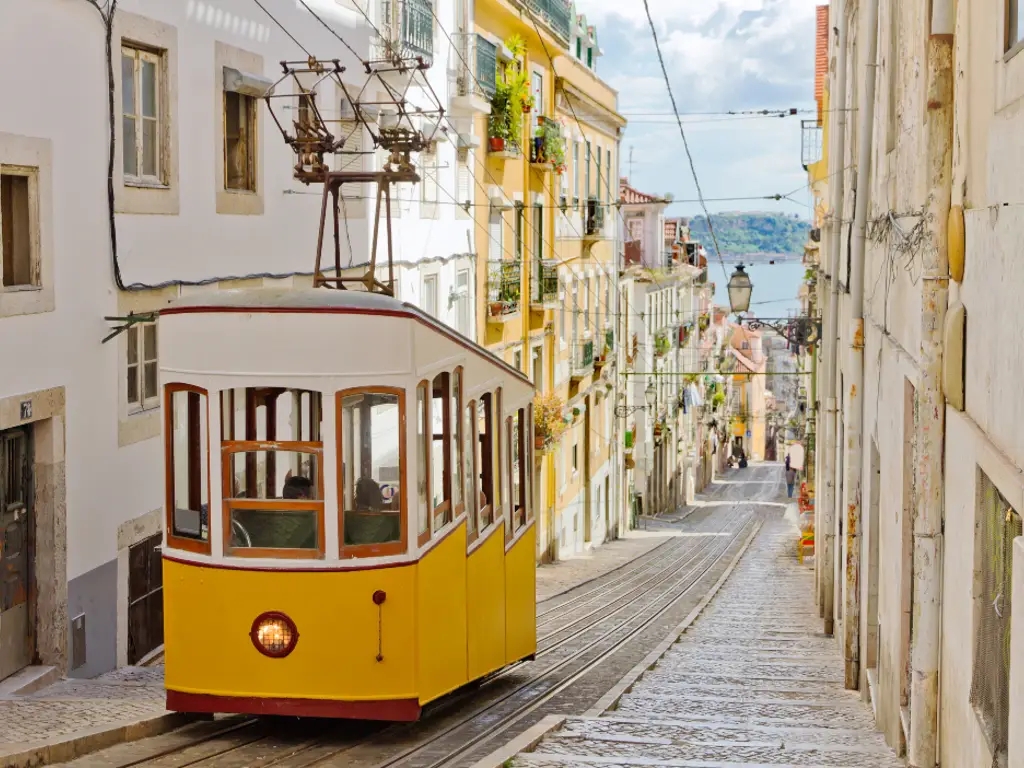 A funicular driving up an alley in Lisbon, Portugal