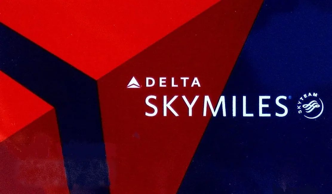The Delta SkyMiles wordmark superimposed on top of the airline's logo