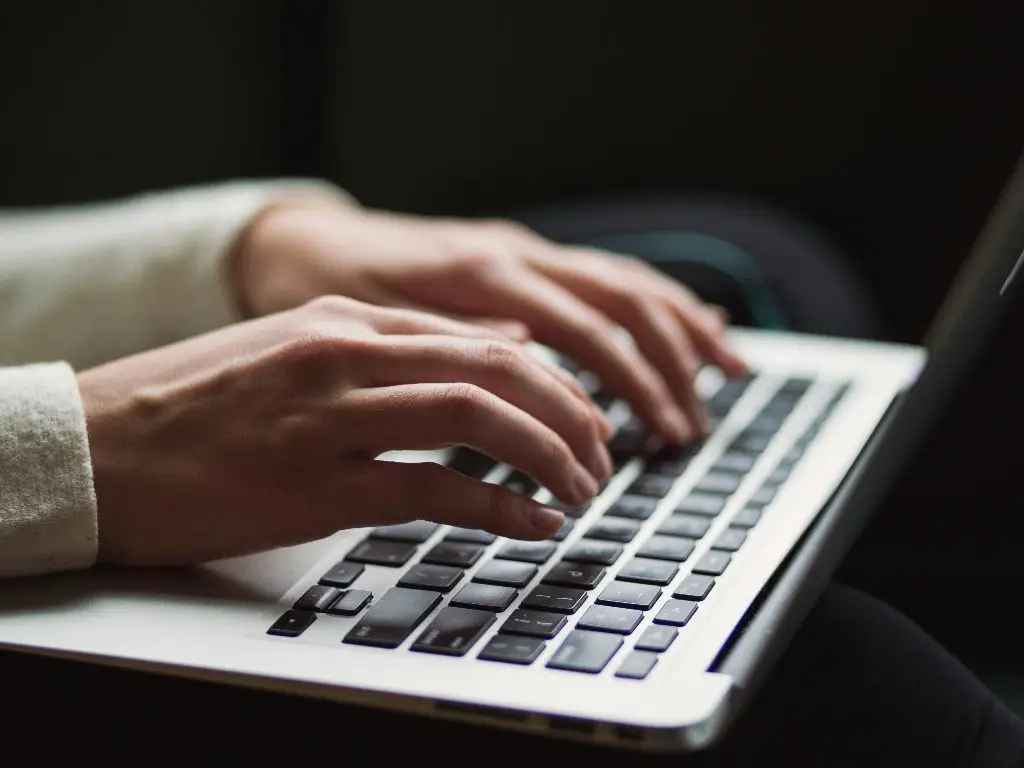 person typing on computer