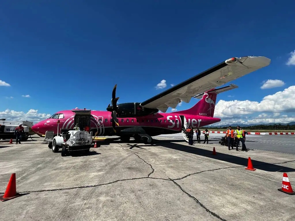 A Silver Airways plane sits on the tarmac. 