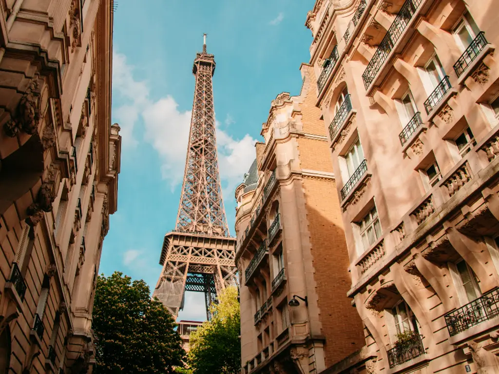 The Eiffel Tower through an alleyway in Paris