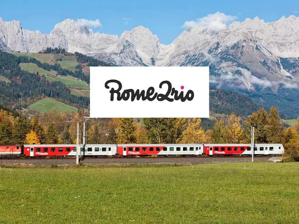 train through the Swiss mountains with Rome2Rio logo 