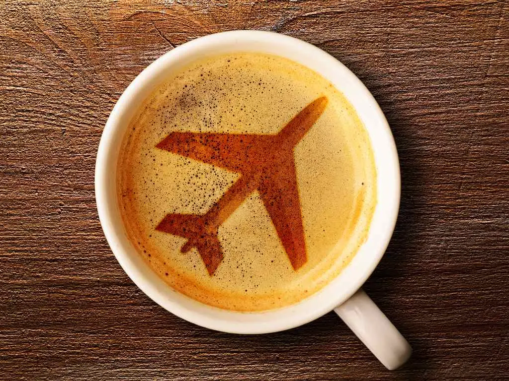 latte with airplane art in foam.