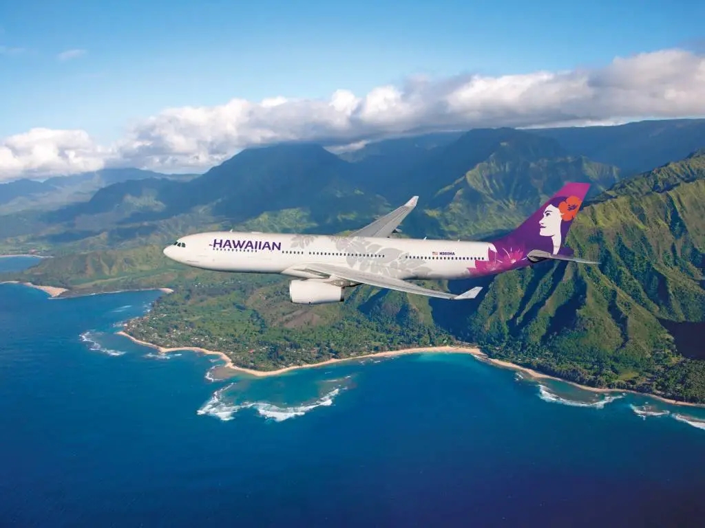 Hawaiian Airlines plane over Hawaii. 