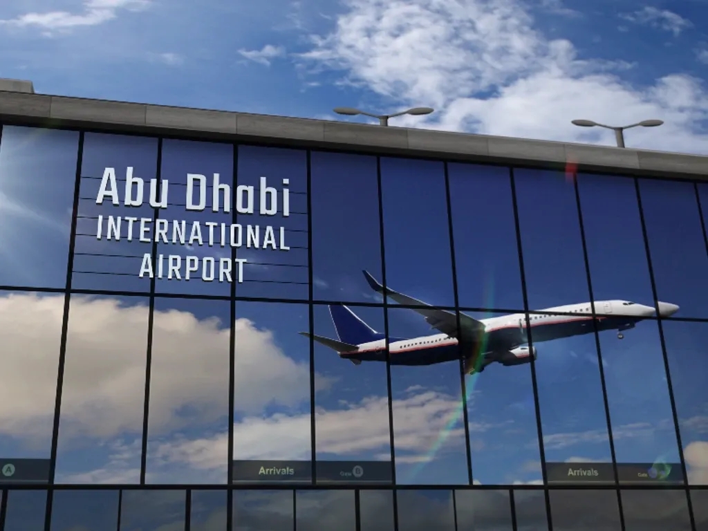 A plane takes off in front of Abu Dhabi International Airport