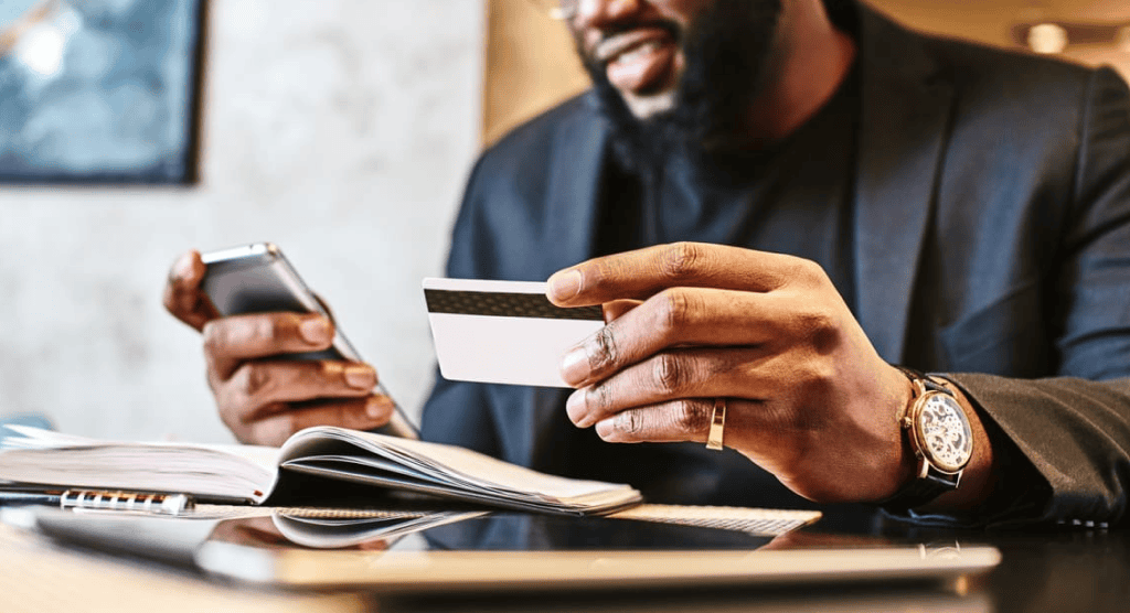 Person using a credit card to make an online purchase