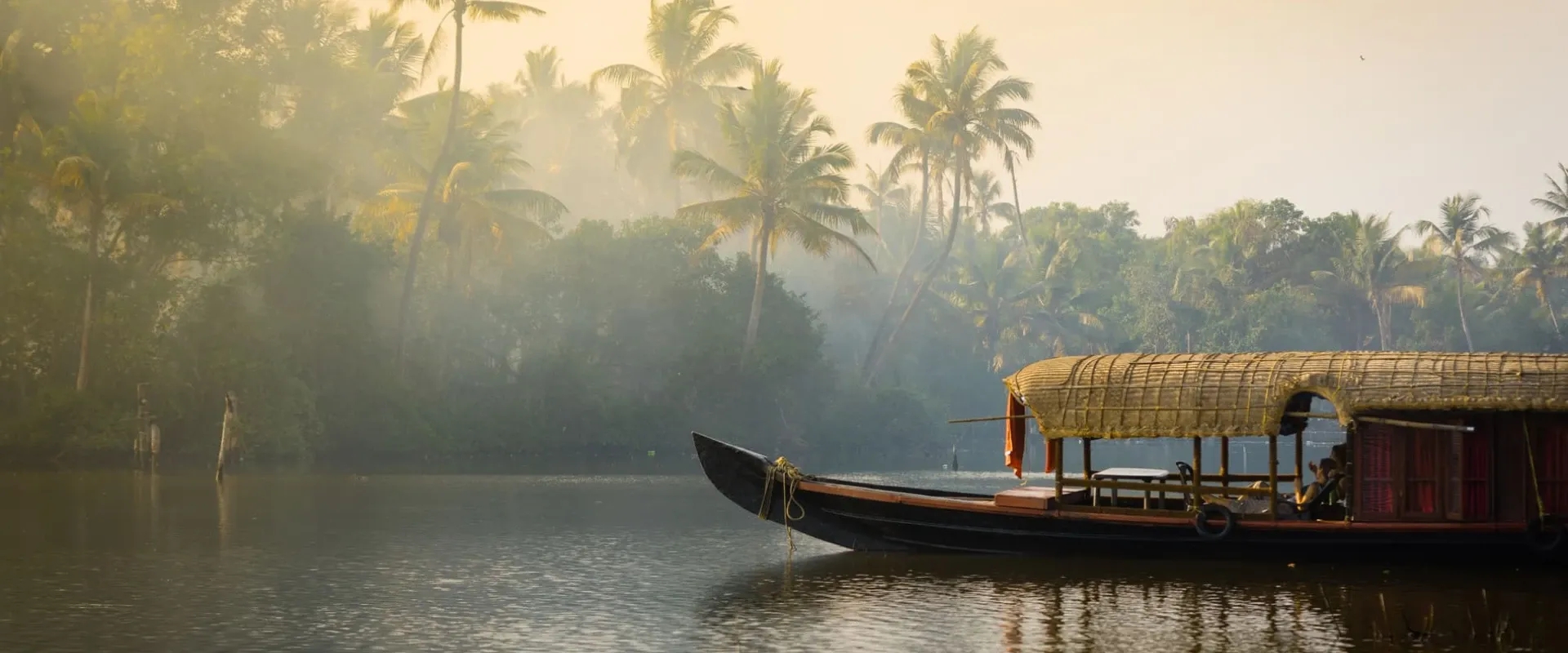 A boat floats in the backwaters of Kerala
