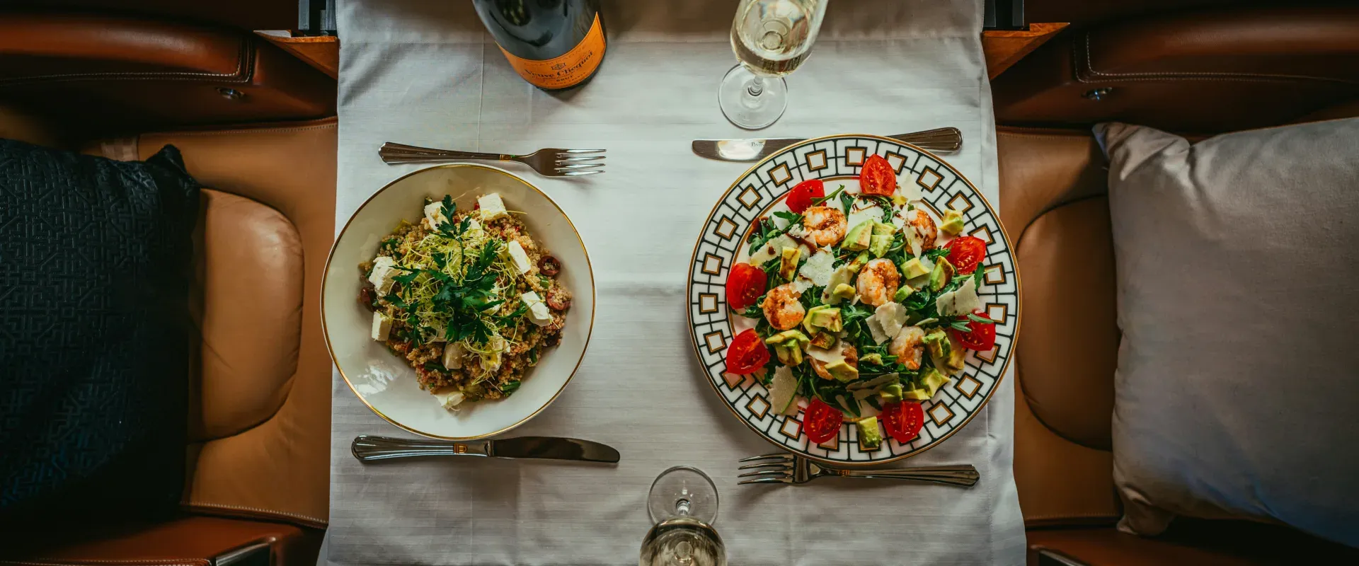 Two plates full of food on a table