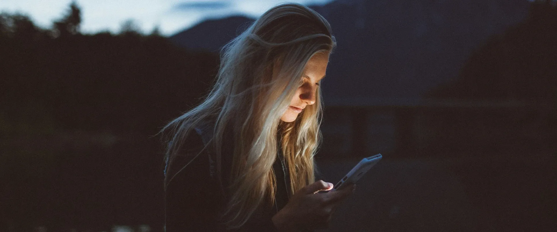 Woman looks at phone