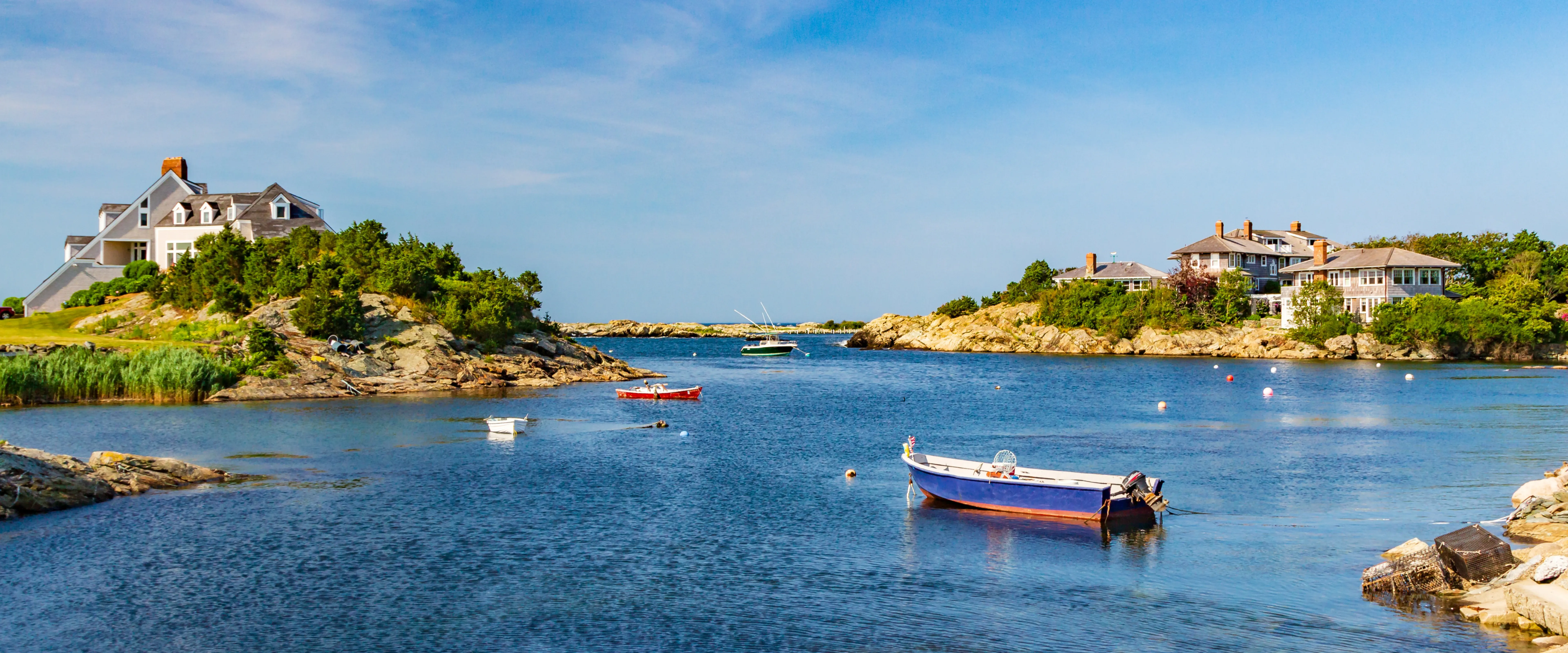 A boat sits off the coast of Rhode Island