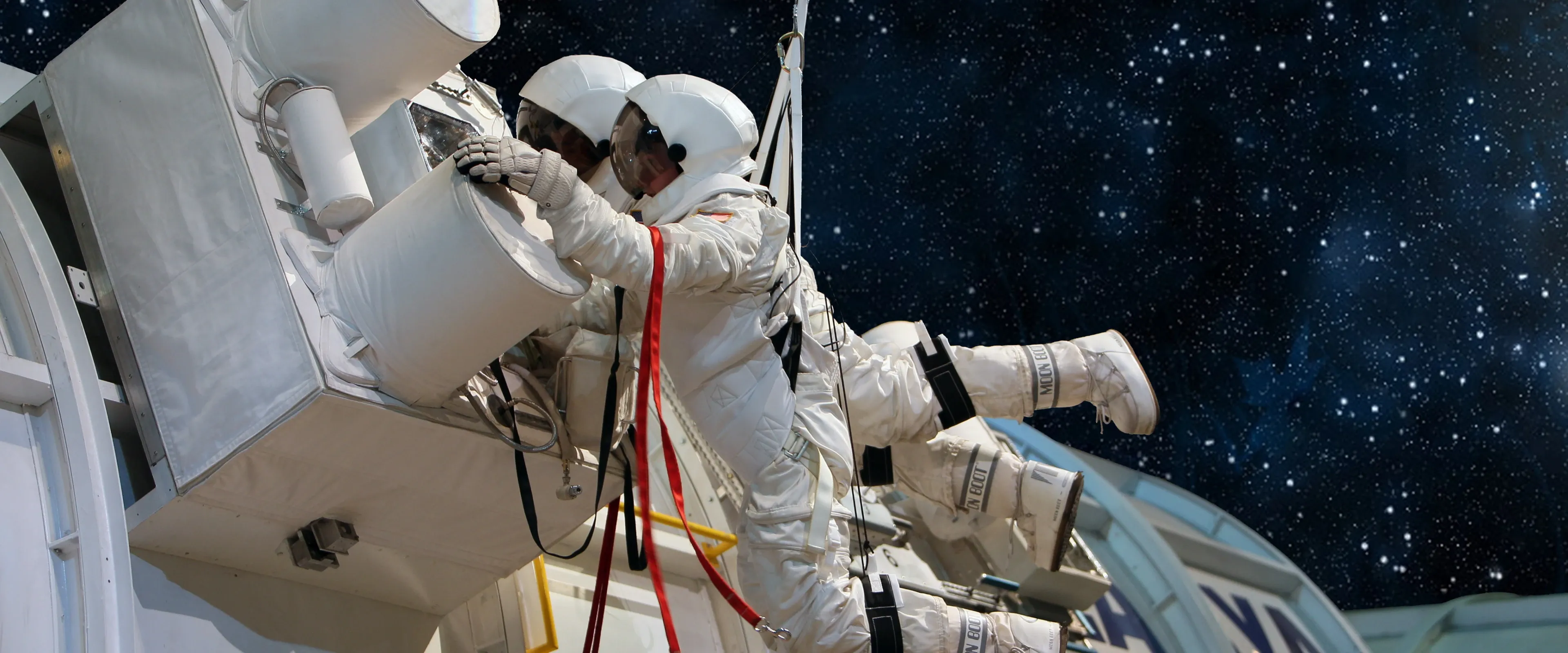 Participants are harnessed up for the space shuttle simulation at Space Camp