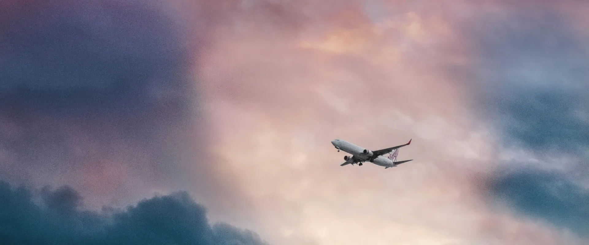 Plane flies in a cloudy sky