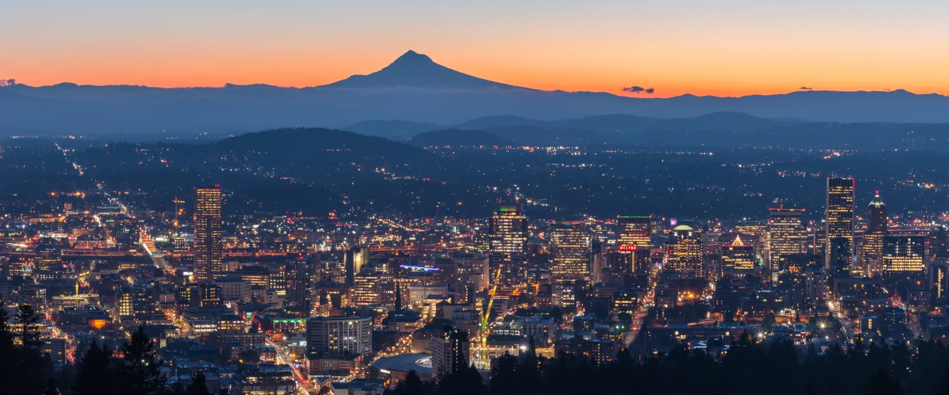 Aerial view of Portland, Oregon, with distant Mount Hood at sunrise