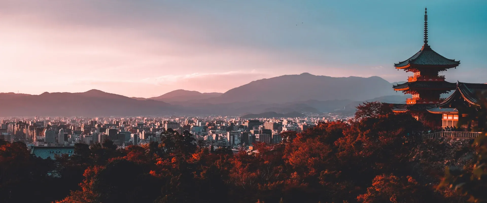 The sun sets over Kyoto in the fall