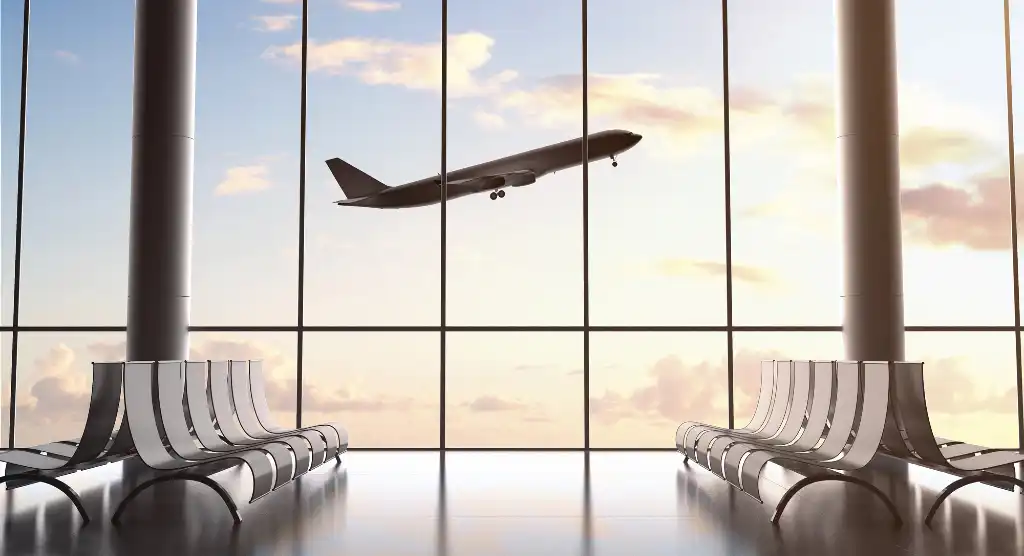 view of plane taking off from airport window