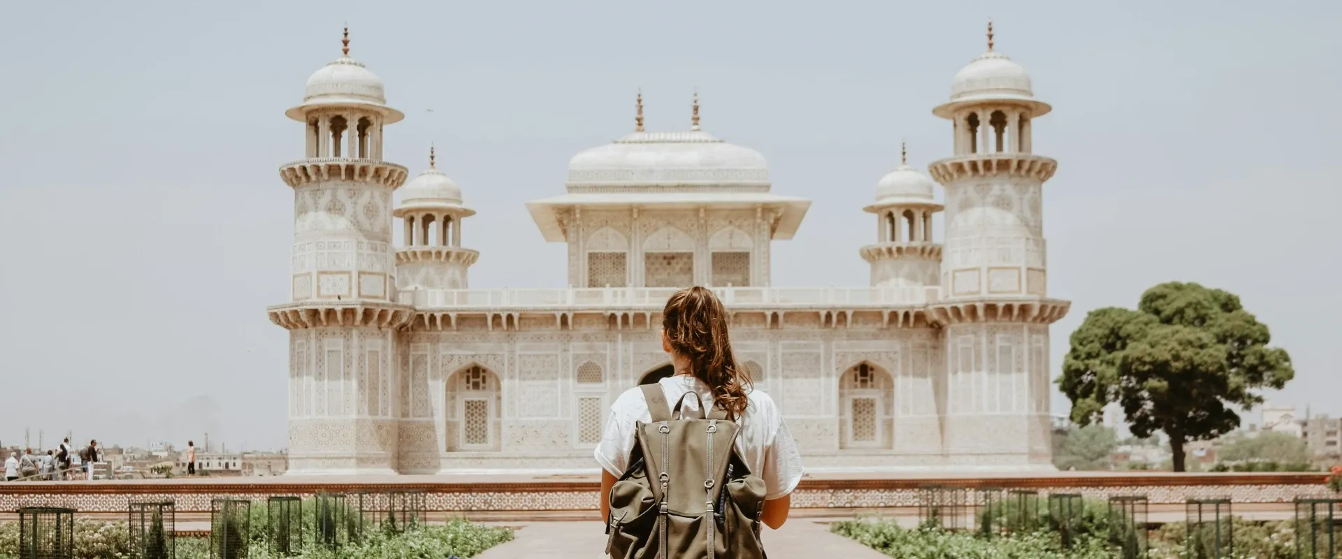 Woman traveling with a backpack through India